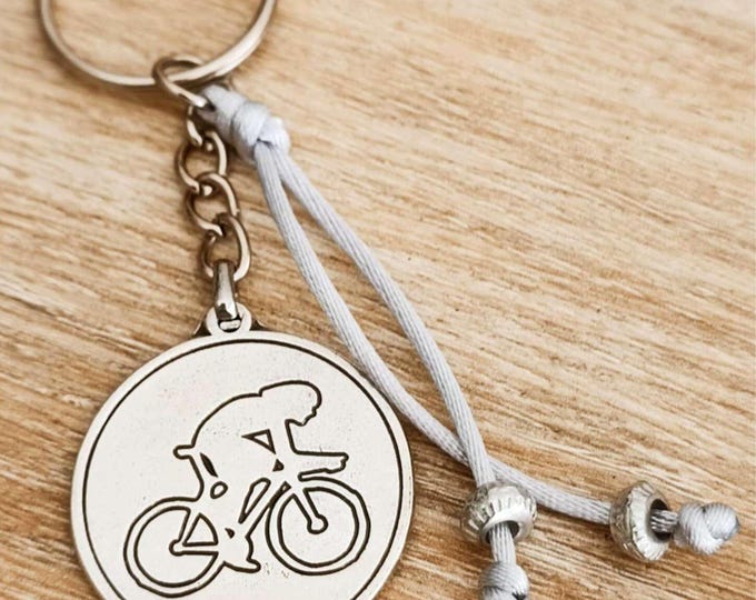 Key ring - Bicycle - ø30mm - with beads and cord.