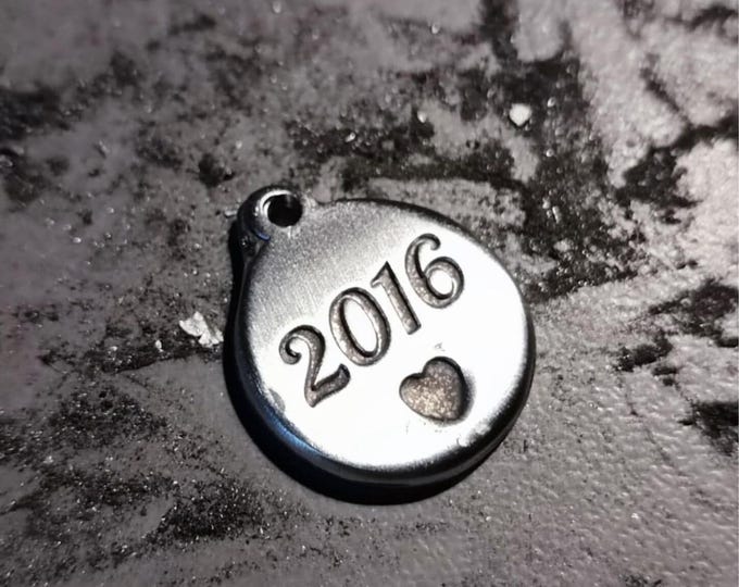 Round medal in raw tinplate 2016 - ø18mm