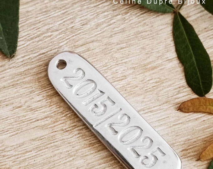 Raw tinplate medal 2015/2025 - Rectangle 10x40mm