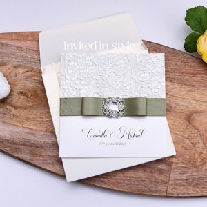 Square wedding invitation, optional pocket. Sculpted embossed paper, ivory metallic card with your choice of ribbon colour SAMPLE