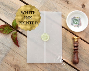 Vellum (transparent paper) wrap/jacket for wedding invitation. White ink printed magnolia line art, flowers. Invitation accessories.