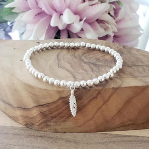 Feather Charm Bracelet: 4mm or 5mm Silver Beads, Stretch Beaded Jewellery