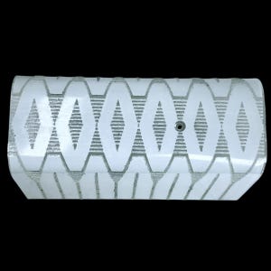 May include: A white, rectangular light fixture with a geometric pattern of diamond shapes and vertical lines. The fixture has a small, circular hole near the center and is set against a black background.