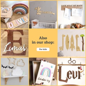 May include: A collection of personalized wooden name signs, including a rainbow arch, a cloud with stars, a ruler with animal illustrations, and a Mickey Mouse design. The signs are made of natural wood and have a rustic, handcrafted look. Also in our shop: For kids.