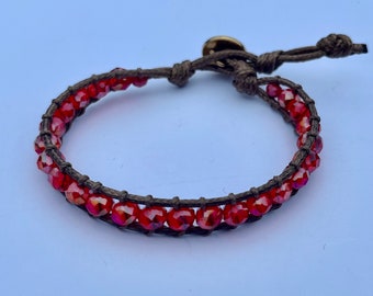 GAHARA - Single-wrap bracelet with clear crimson red faceted beads and a lotus button clasp | stylish | casual | fashion accessory | for her