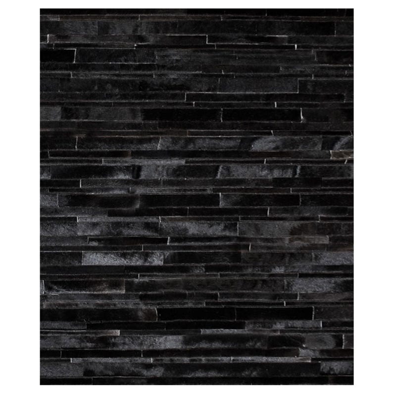 Pu&ograve; includere: Primo piano di un muro con una superficie scura e strutturata. Il muro &egrave; costruito con pezzi rettangolari orizzontali in varie tonalit&agrave; di nero. I pezzi sono disposti in un motivo sfalsato, creando un design visivamente interessante e moderno.
