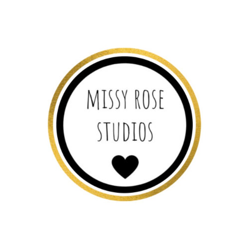 May include: A circular logo with a gold outer ring, a black inner ring, and a white center. The text "MISSY ROSE STUDIOS" is in the center, above a black heart icon. The logo is on a white background.