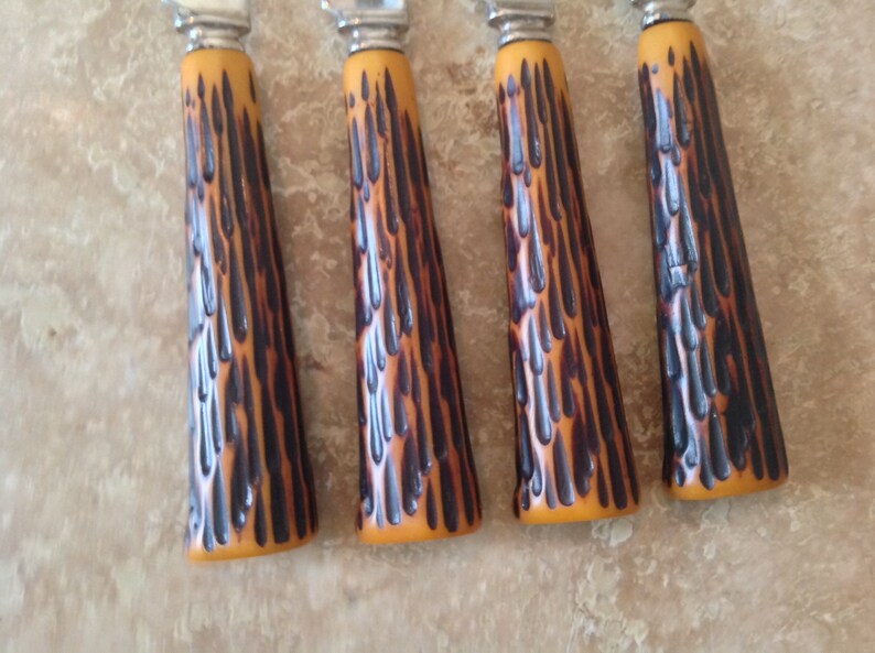 Set of 4 knives with faux antler handles