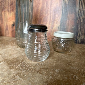 Selection of glass items, salad dressing bottle, Parmesan shaker, storage jar, ships from Canada