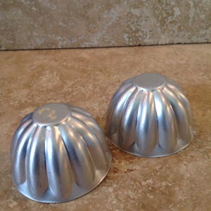 Pair of fluted tin  moulds, vintage, ships from Canada
