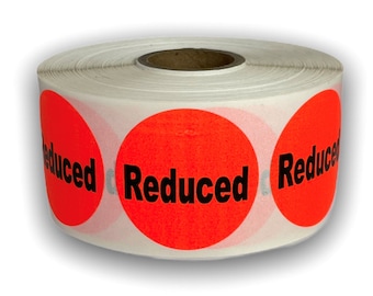May include: A roll of white labels with bright red circular stickers. Each sticker has the word "Reduced" printed in bold black letters. The labels are designed for retail or promotional use.