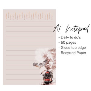 May include: An A6 notepad featuring a watercolour illustration of a train and an owl flying through snow. The notepad has 50 pages and a glued top edge. It is made from recycled paper. The text on the notepad reads "A6 Notepad - Daily to do's - 50 pages - Glued top edge - Recycled Paper".