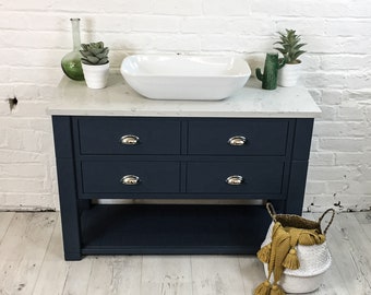 Bespoke bathroom Vanity unit made to any size. Drawer top with low shelf and white marble effect quartz top. Grey Farrow & Ball painted base