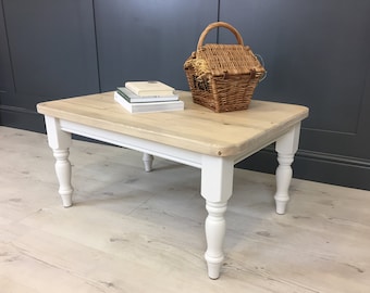 Country style reclaimed wood coffee table with painted turned legs in a farmhouse style