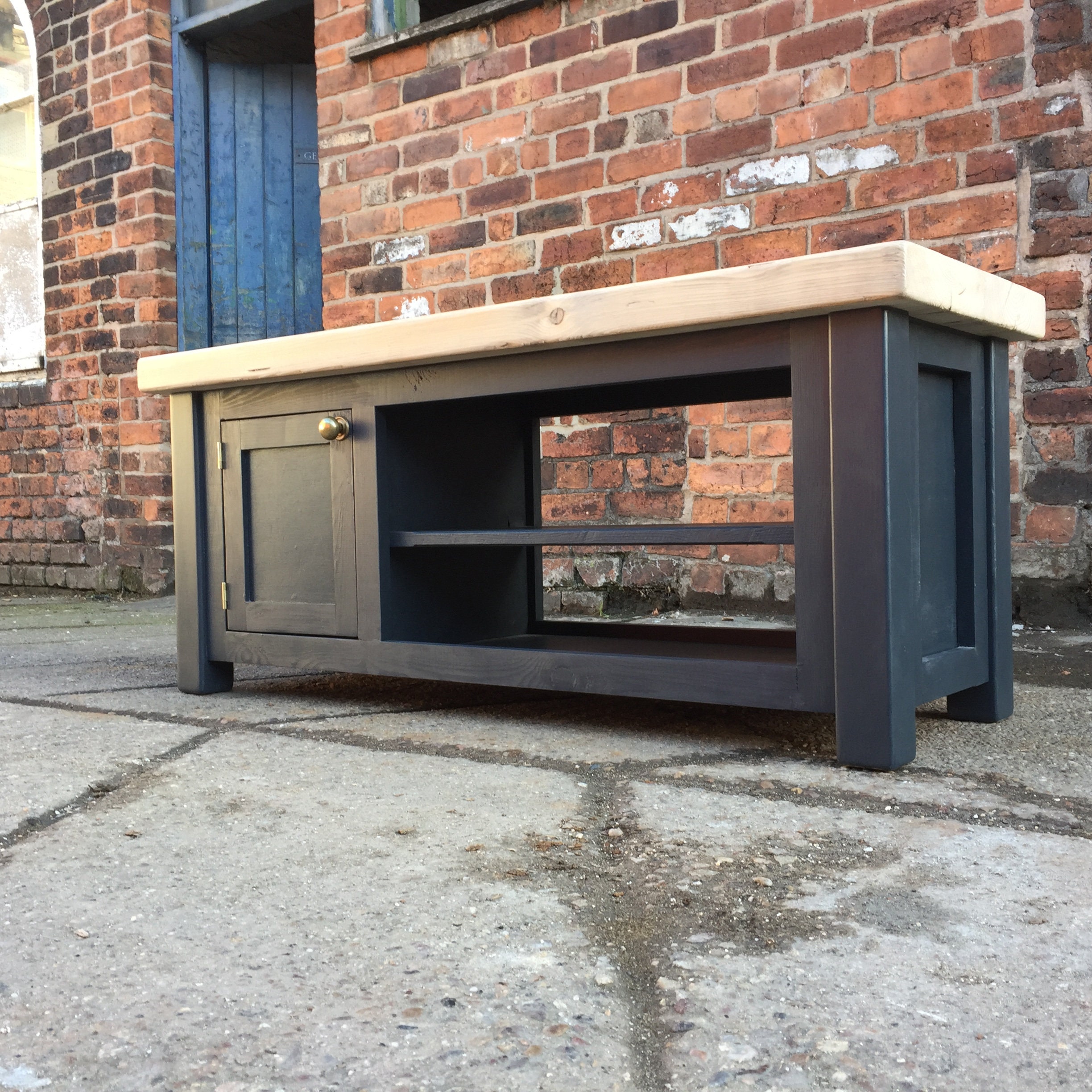 Low TV Unit With Open Shelves and Small Side Door Painted in