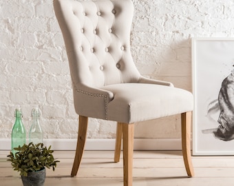 Alma wing back Upholstered Dining Chair with button back and chrome knocker. Light grey or dark grey