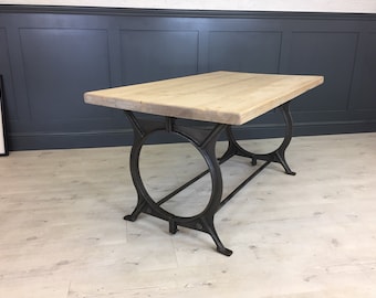 Reclaimed Wood Table with industrial O Frame Base. Cast Iron frame with rustic top