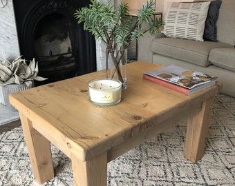 Rustic coffee table with thick pine wood top and chunky tapered legs. Made to measure in any size and wood finish