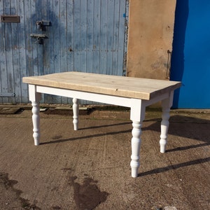 Thick top rustic pine wood farmhouse dining table. Made to measure in any size with chunky Pine top