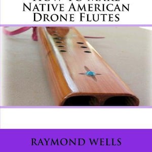 May include: A wooden Native American drone flute with a polished finish. The flute has a turquoise inlay and several finger holes. The image includes the text "How To Make Native American Drone Flutes" and the name "Raymond Wells".