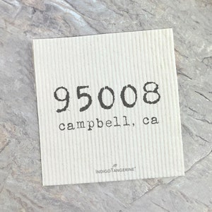 May include: Square, off-white paper with vertical lines. The number "95008" is printed in a dark, typewriter-style font, with "campbell, ca" below it. The "INDIGOTANGERINE" logo is at the bottom.
