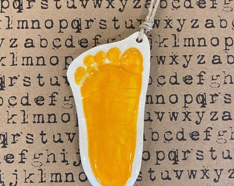 Newborn organic cut footprint ornament keepsake in yellow