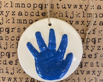 Newborn handprint ornament keepsake in medium blue ceramic