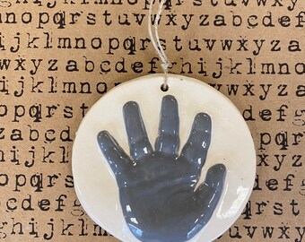 Newborn handprint ornament keepsake in grey ceramic