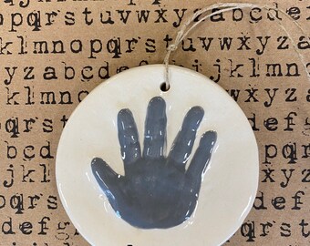 Newborn handprint ornament keepsake in grey ceramic