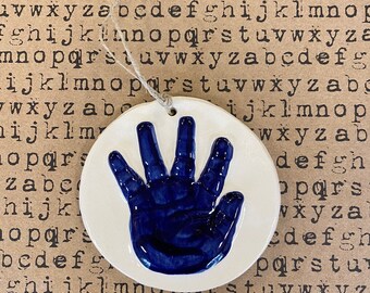 Newborn handprint ornament keepsake in cobalt blue ceramic