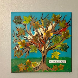 This is a 12”x 12” mixed media canvas titled “The Colors of Fall”