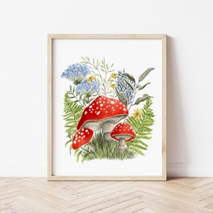 May include: A watercolor painting of red and white mushrooms with white spots growing in a cluster of green ferns and blue and yellow flowers.