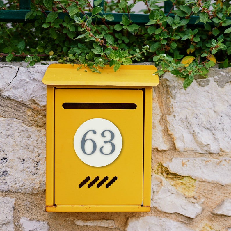 Custom mailbox and letterbox numbers cut from acrylic. Custom cut and made to order. High quality adhesive acrylic house numbers with disc for your mailbox. Minimalist and elegant styling to make identifying your house easy.