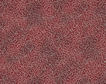 May include: A red fabric with a white swirl pattern. The fabric has a textured look.
