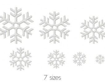 Op de afbeelding: Zeven witte sneeuwvlokontwerpen in verschillende maten. De sneeuwvlokken zijn 3D en hebben een matglazen look.