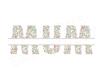May include: Floral embroidery design of the word "ANNA" with a banner underneath. The letters are made of pink, blue, and green flowers.