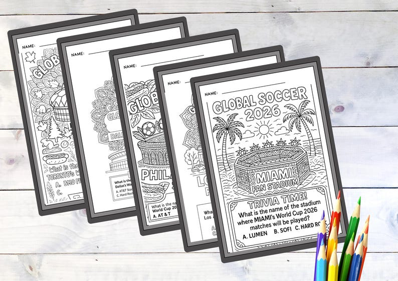 May include: A stack of black and white coloring pages with the text "GLOBAL SOCCER 2026" and trivia questions. The pages feature illustrations of stadiums, soccer balls, and other soccer-related imagery. Colored pencils are in the foreground.