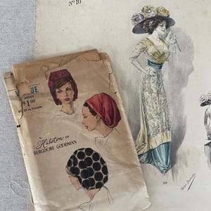 May include: Vintage fashion illustration featuring a woman in an elegant gown and hat, alongside a pattern from Halston of Bergdorf Goodman. The illustration is from "Grand Luxe Parisien" No. 10, with additional sketches of headwear.