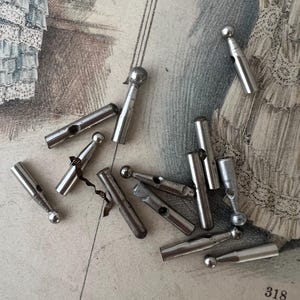 antique metal parasol ends.  umbrella tips