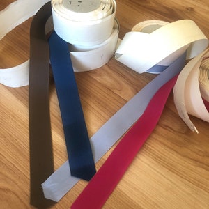 By the spool.  Vintage ribbon.  You choose color