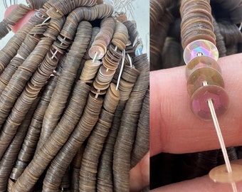 May include: A strand of brown iridescent sequins, with a close-up of the sequins showing their iridescent sheen.