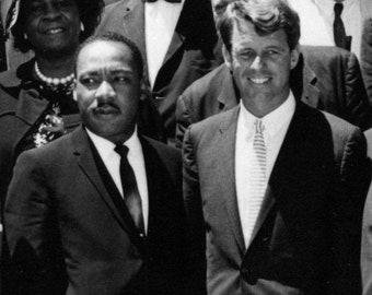 May include: Black and white photo of two men in suits and ties. The man on the left is Martin Luther King Jr. and the man on the right is Robert F. Kennedy.