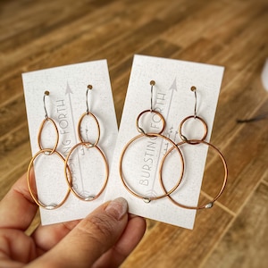 Handmade Mixed metal copper long round or oval dangle earrings with silver solder accents.