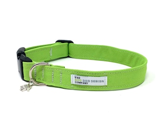 May include: A lime green dog collar with a silver paw charm and a white label that reads "THE ECO DOG DESIGN COMPANY".