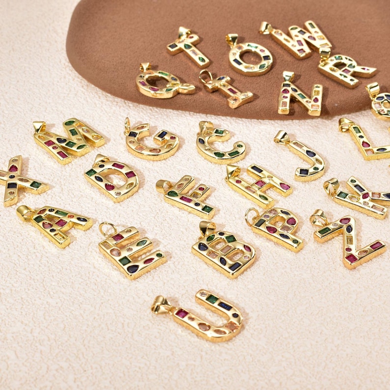 Premium craftsmanship: smooth plating, secure stone setting, bold letter shapes