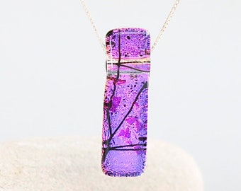 Purple fused glass pendant on a sterling silver necklace