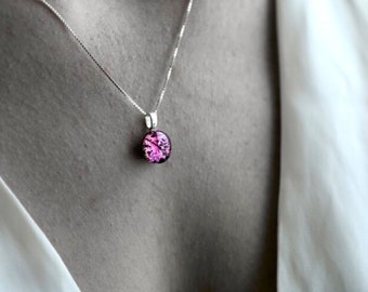 Shocking pink fused glass pendant on a sterling silver necklace