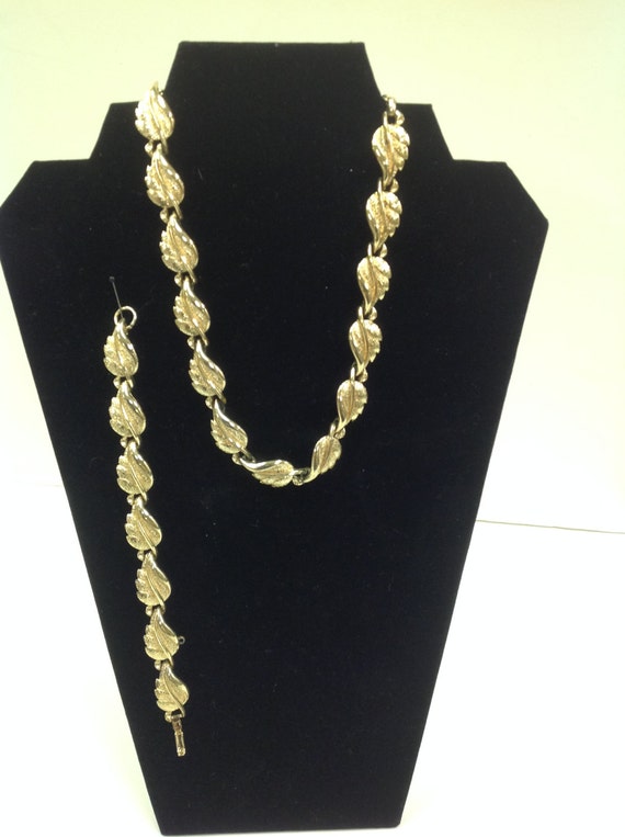 Vintage signed Coro choker with white thermoplastic squares set in goldtone metal.