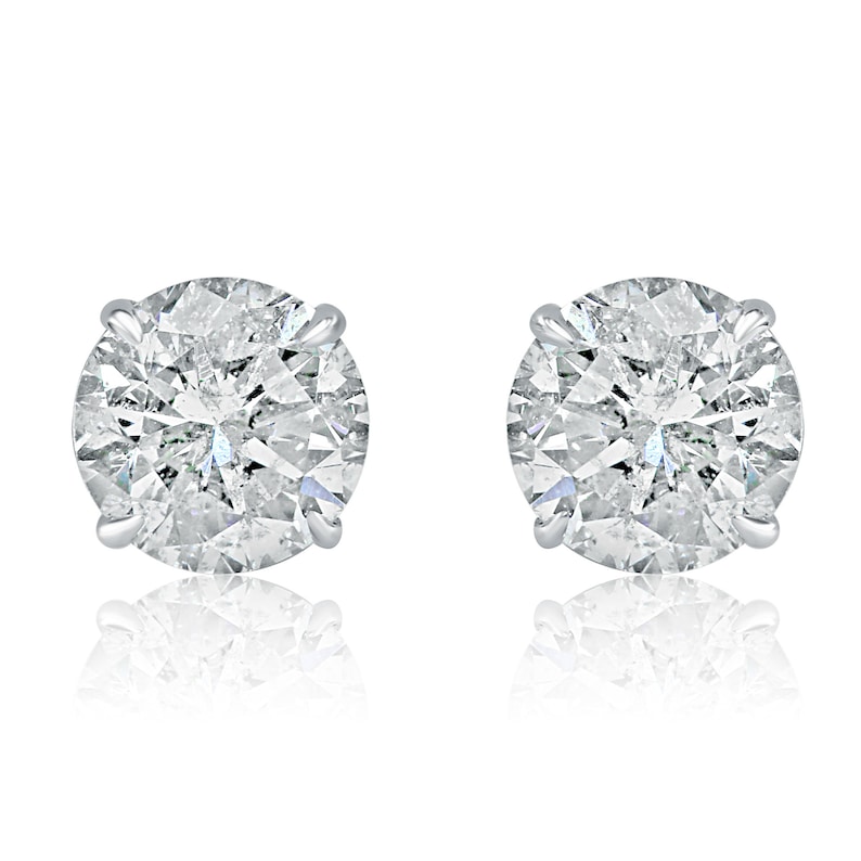 May include: A pair of round diamond stud earrings set in silver.