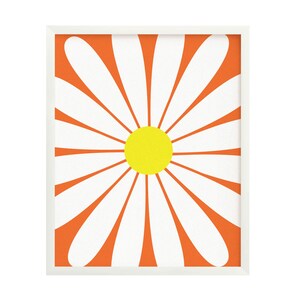 May include: A framed print of a stylised white daisy with an orange background and a yellow centre.